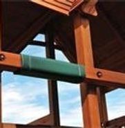 A close up of a wooden structure with a blue sky in the background.
