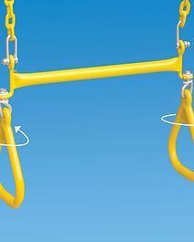 A yellow swing with a blue sky in the background.