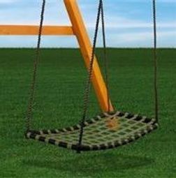 A net swing is hanging from a wooden post in a grassy field.