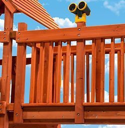 A wooden deck with binoculars on top of it.