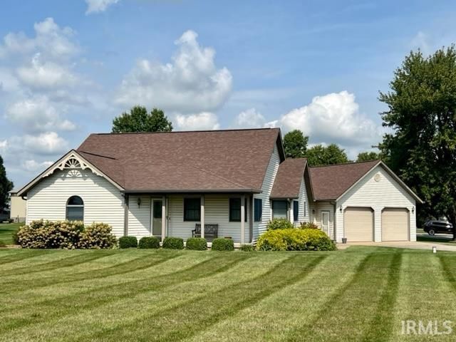A house with a brown roof is for sale