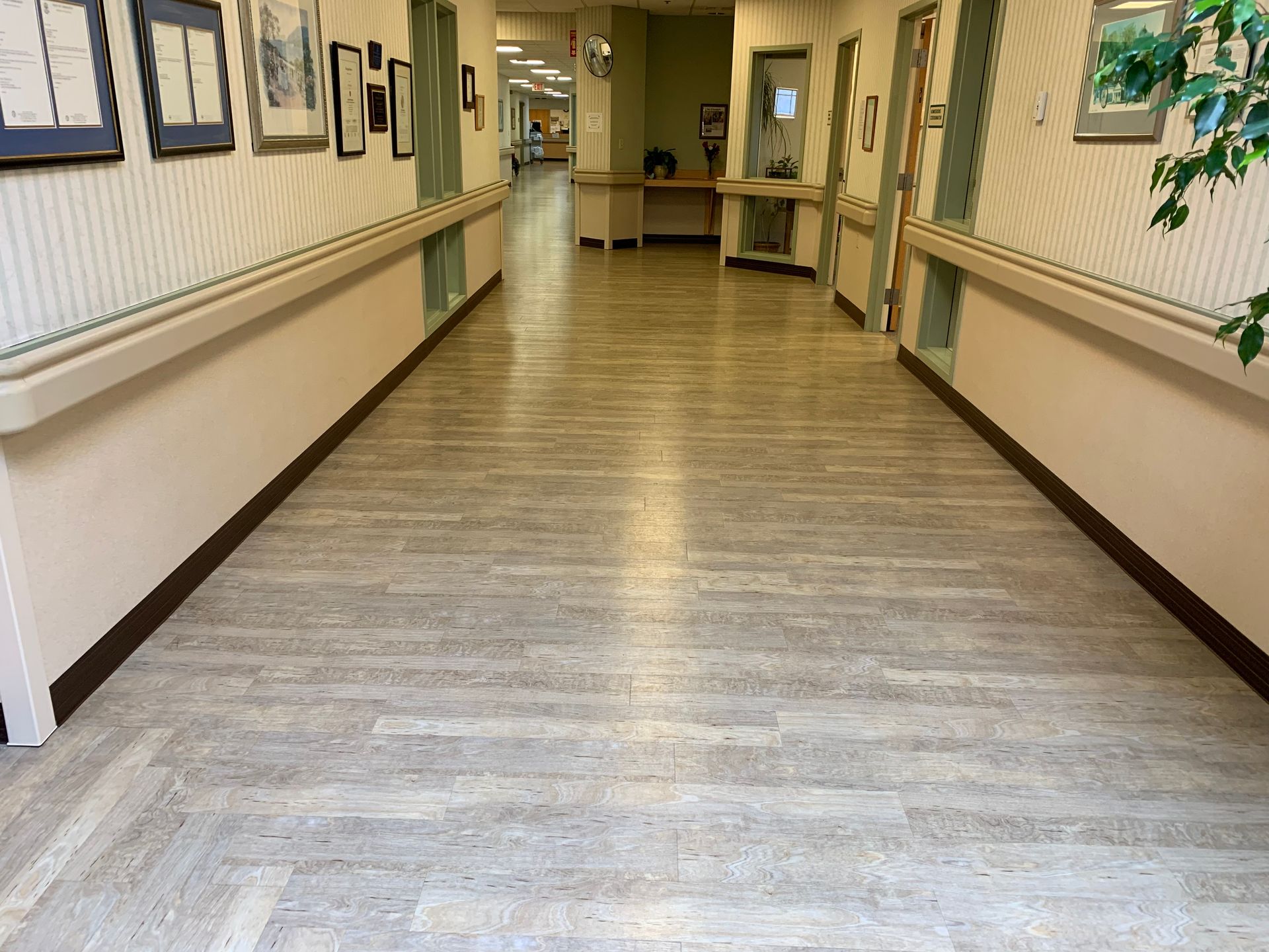 A long hallway with a wooden floor
