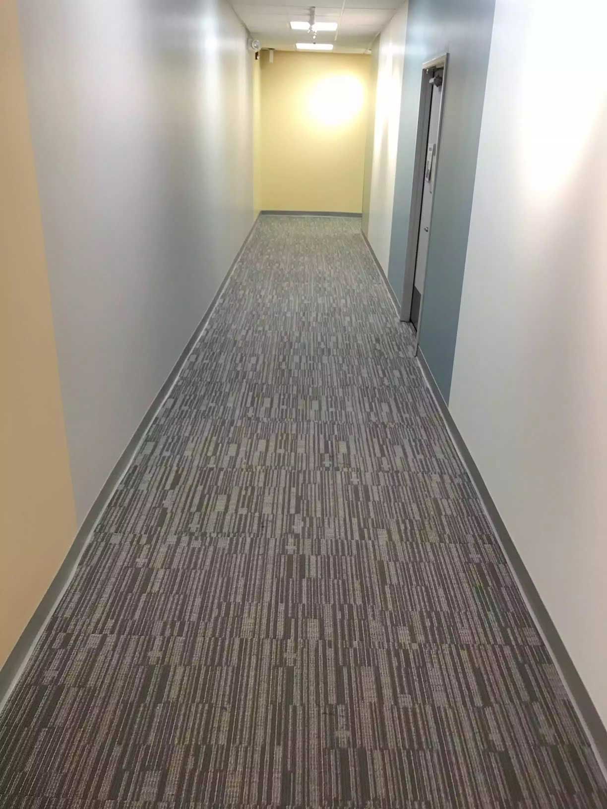 newly installed carpet along the corridor