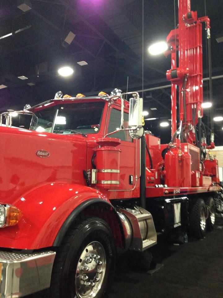 A red semi truck with the word peterbilt on the side