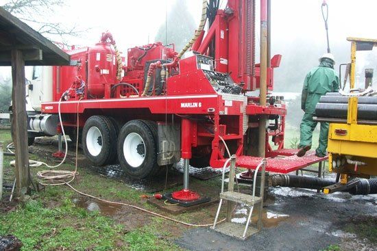 A red truck with the word drill on it