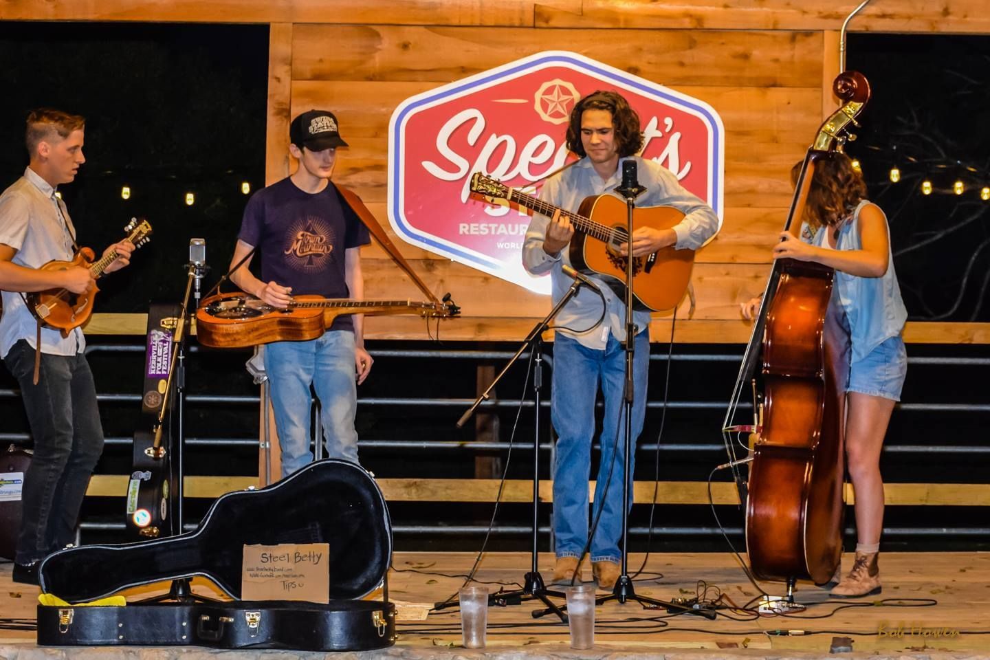 A group of people are playing instruments on a stage.