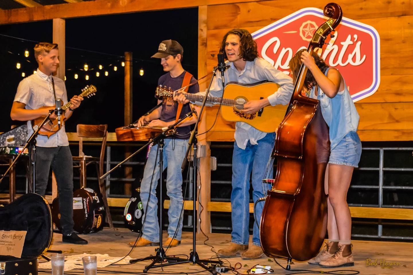A group of people are playing instruments on a stage.