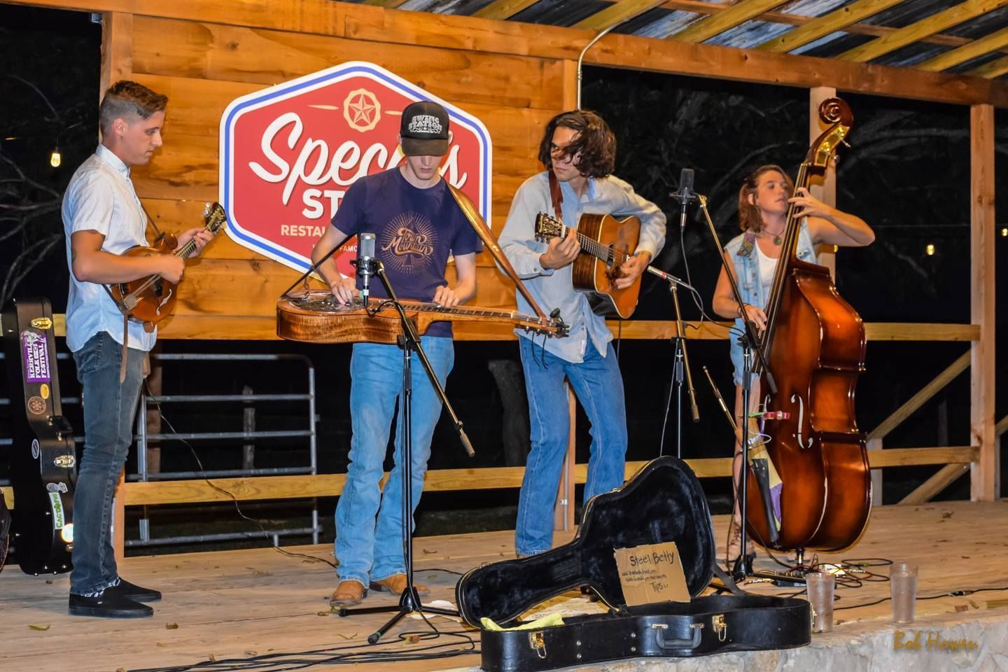 A group of people are playing instruments on a stage.