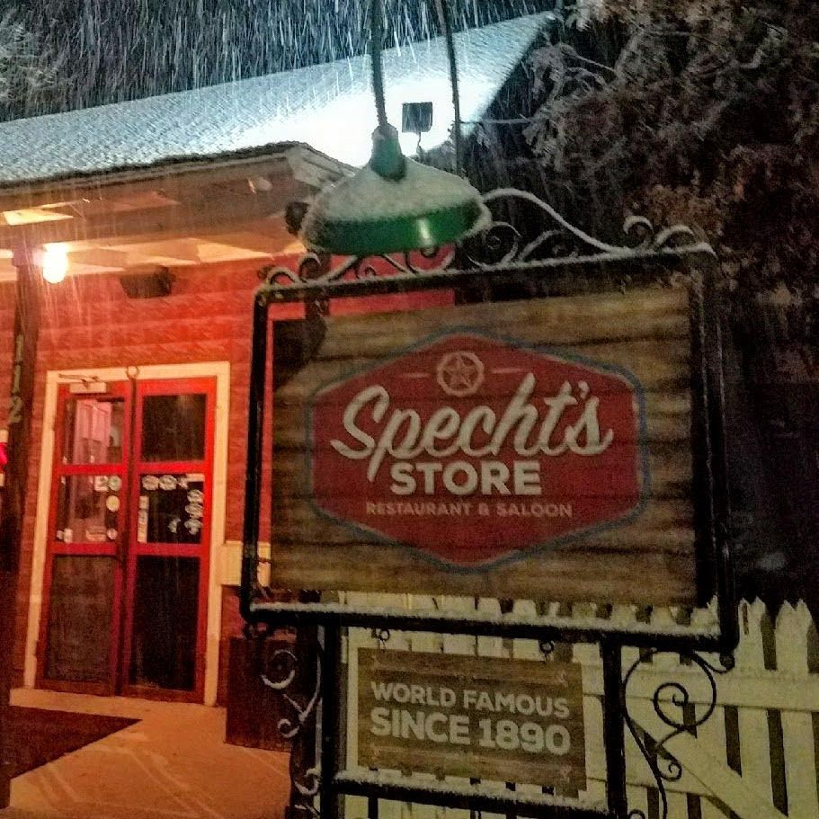 A sign for Specht's store restaurant and saloon.