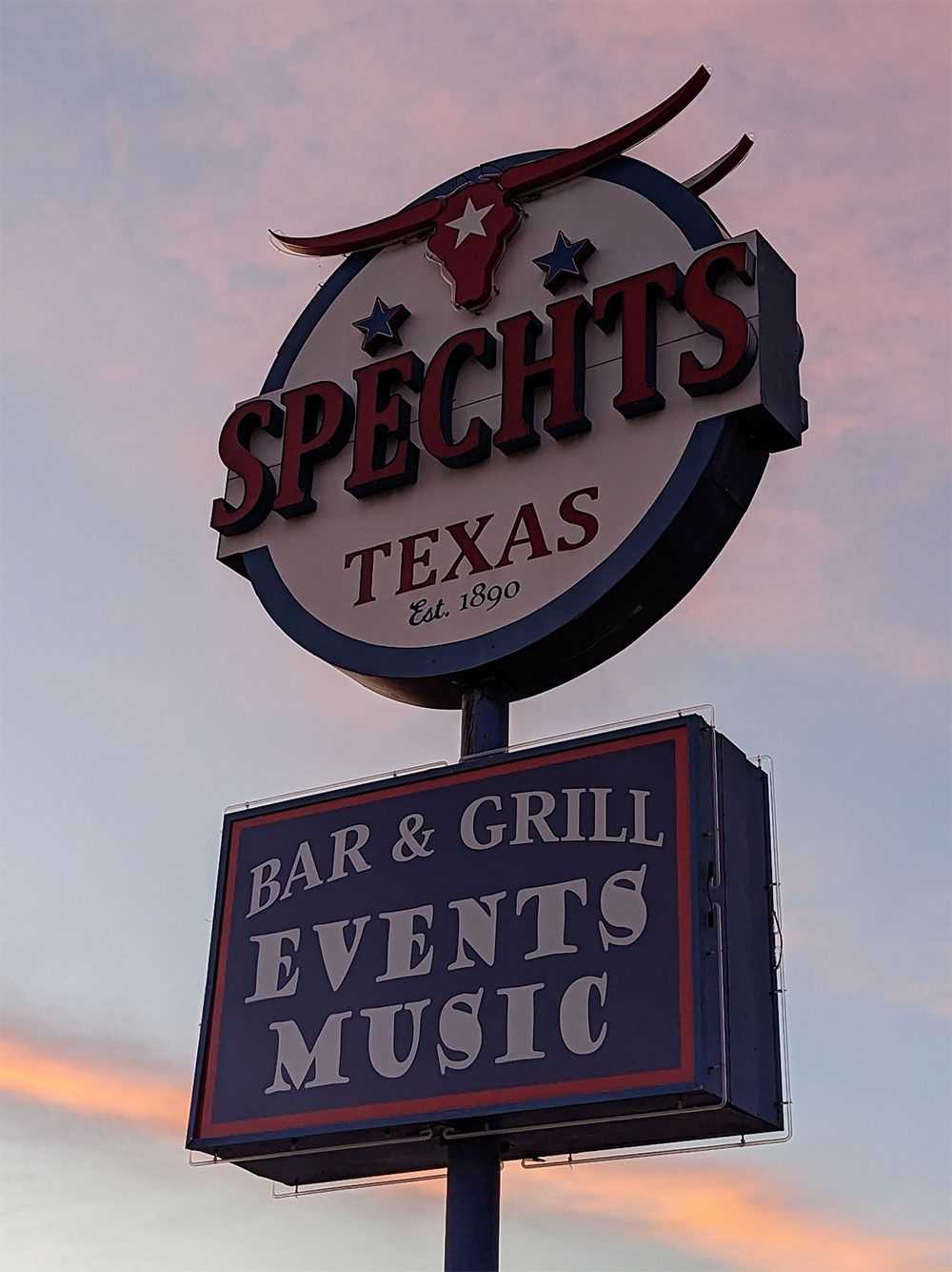 A red building with a sign that says speech's store.