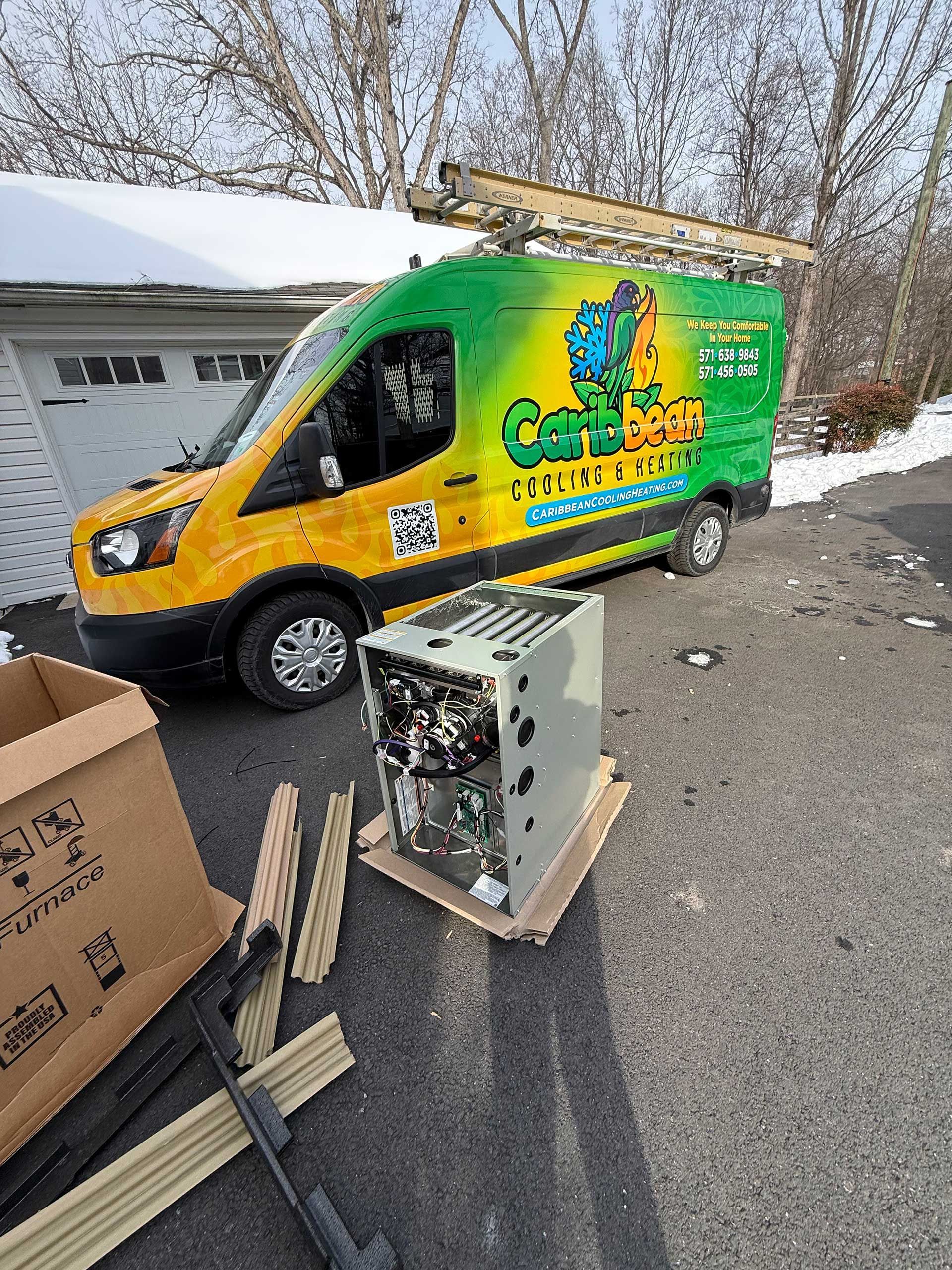 Bright green and yellow delivery van parked by a garage, with a discarded box and debris in the foreground