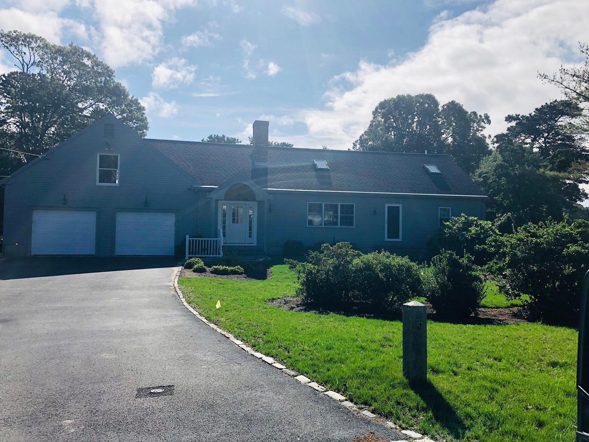 A large house with a driveway leading to it