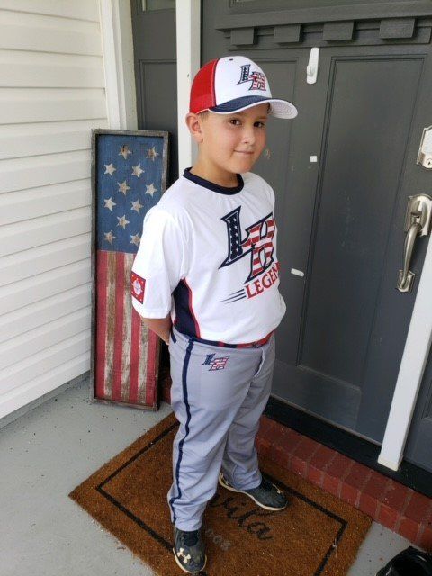 kid in baseball uniform