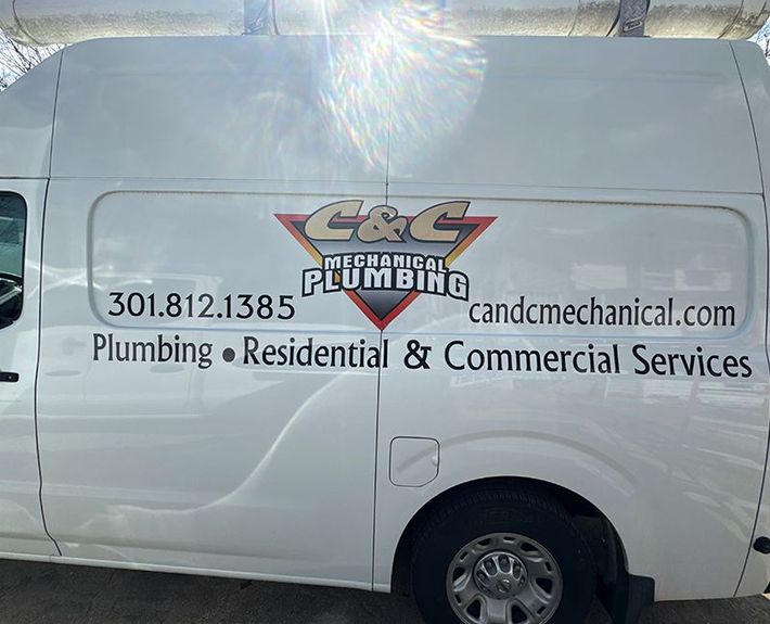 A white van with mechanical plumbing written on it