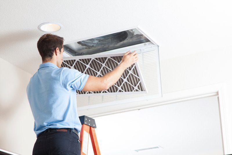 Professional Technician Cleaning Air Duct in Volusia & Flagler Counties