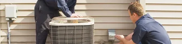 Technicians Installing Air Conditioner AC Installation Services in Volusia & Flagler Counties, FL