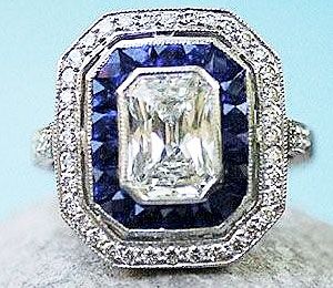 Diamond ring with blue gemstone accent