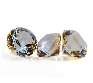 three polished gemstones