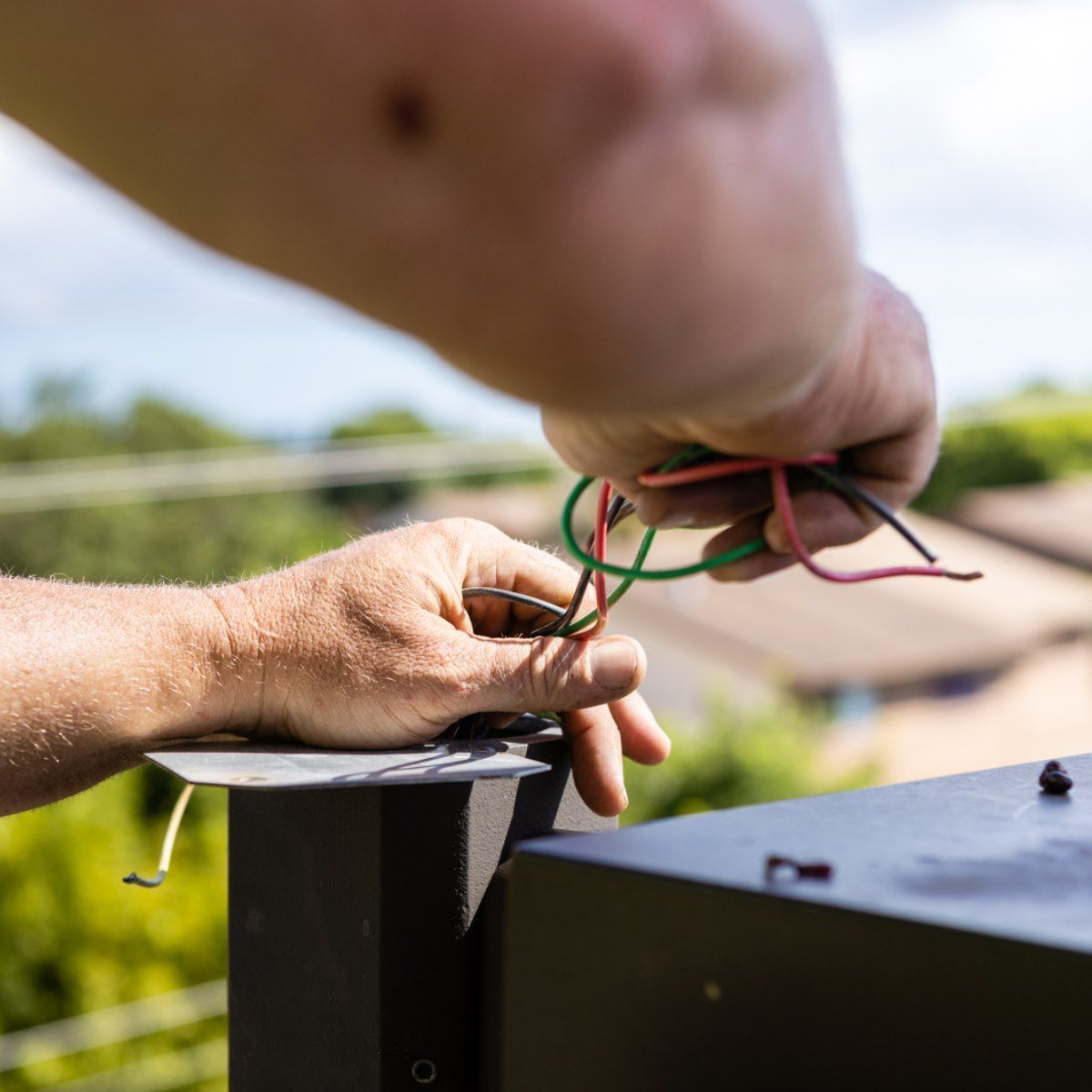 A person is holding a bunch of wires in their hands