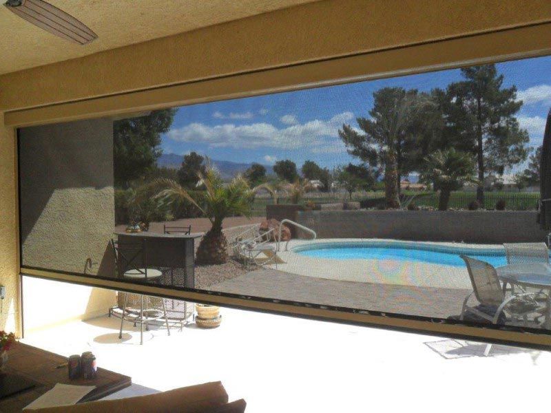 A large window with a view of a swimming pool