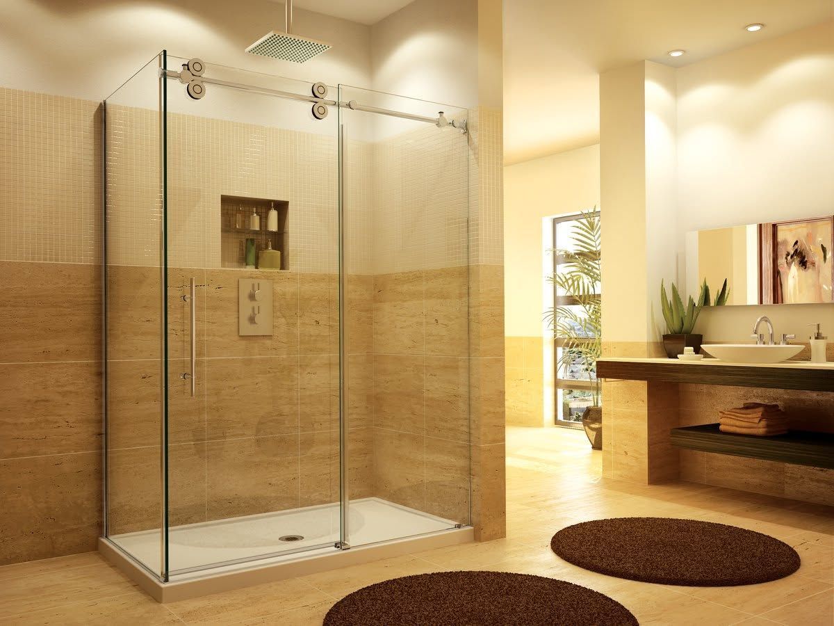 Modern bathroom with glass shower enclosure, beige tile, sink vanity, and round brown rug.