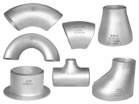 Assorted silver metal pipe fittings: elbows, reducers, tee, and flanged couplings on white background