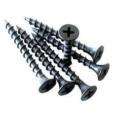 Several black Phillips-head screws stacked in a pile on a white background