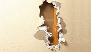 Damaged wall covering