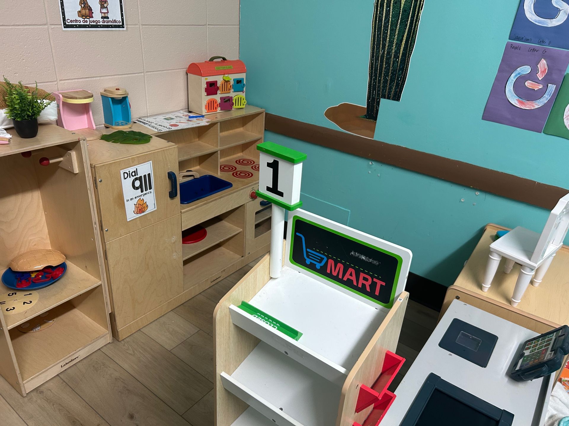 Play grocery store with shelves, a checkout counter, and food items.