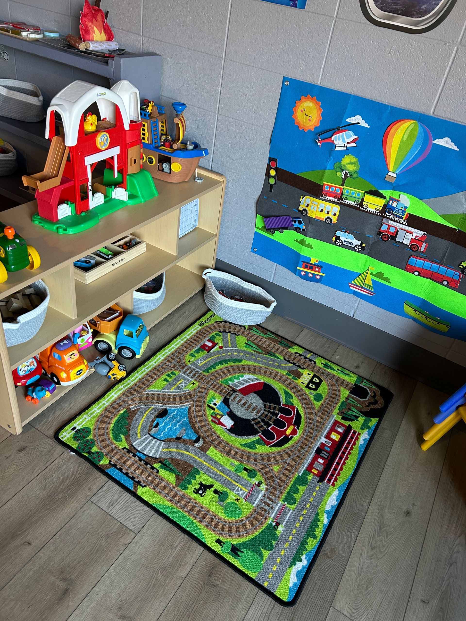 Childcare room with gray cubby shelves, toys, and pumpkin decorations.