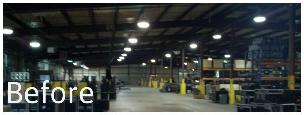 Warehouse interior before renovation, with empty floor, shelves, and overhead lights.