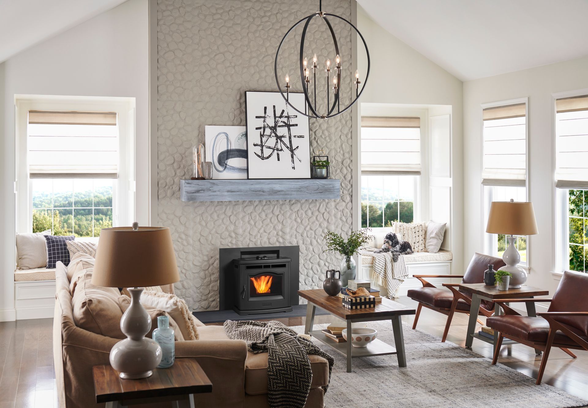 Cozy living room with fireplace, windows, and seating. Neutral tones, soft textures, and natural light.