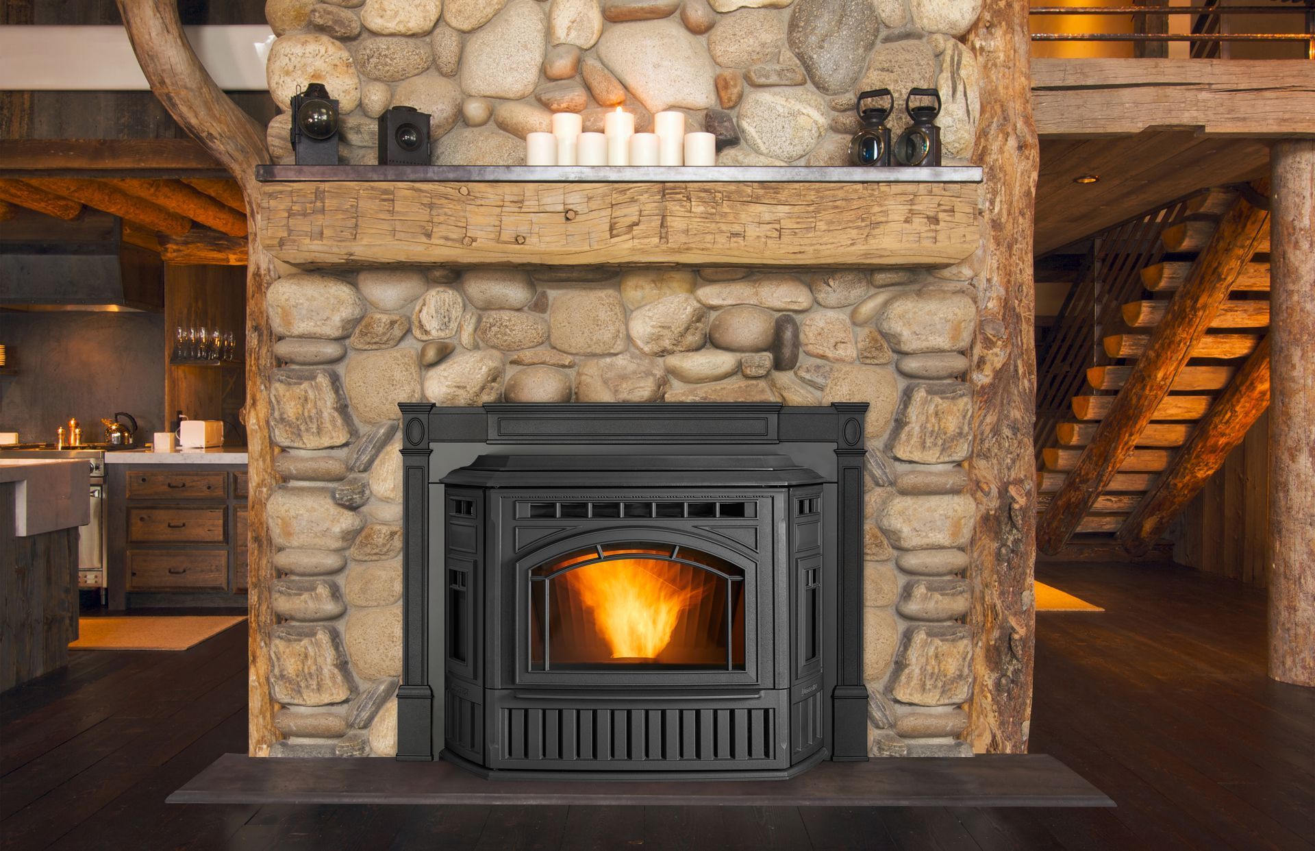 Black pellet stove with flames set in a stone fireplace, candles and shelves above.