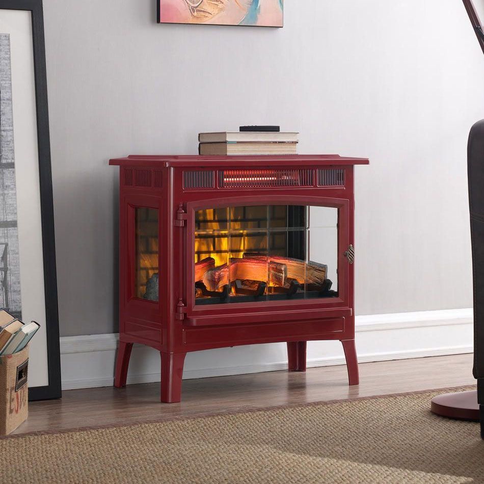 Red electric fireplace in a living room, with art and a lamp.