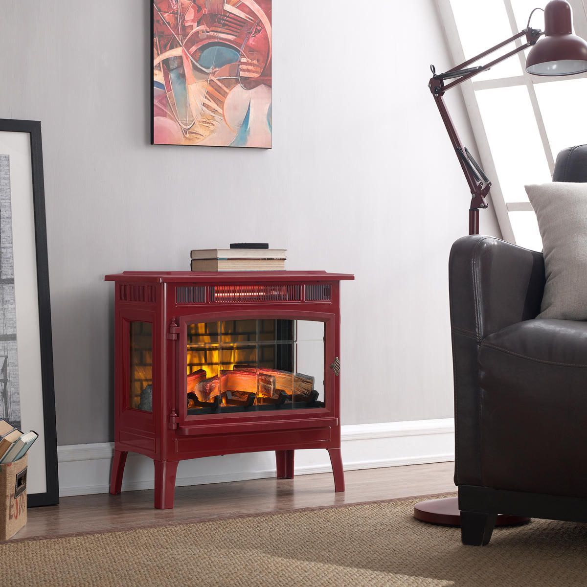 Red electric fireplace in a living room, with a brown couch and a lamp.