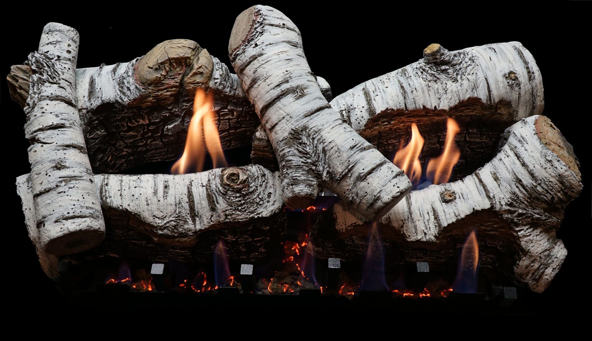 Birch log gas fireplace with orange flames, black background.