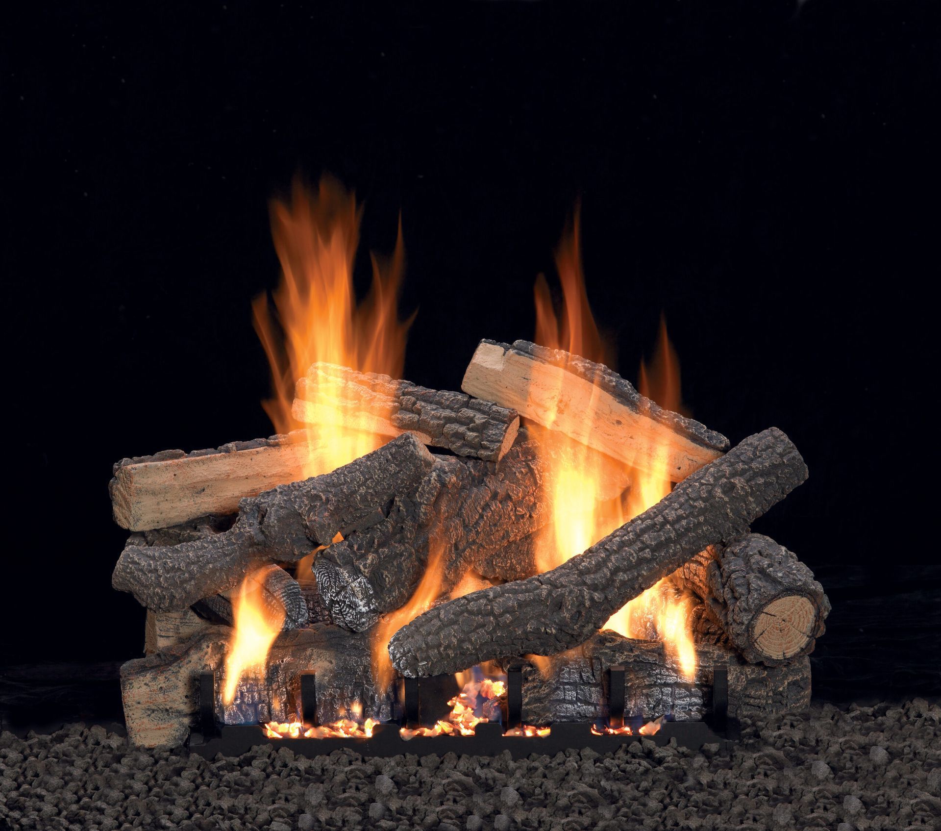 Burning fireplace with artificial wooden logs and flames against a dark background.