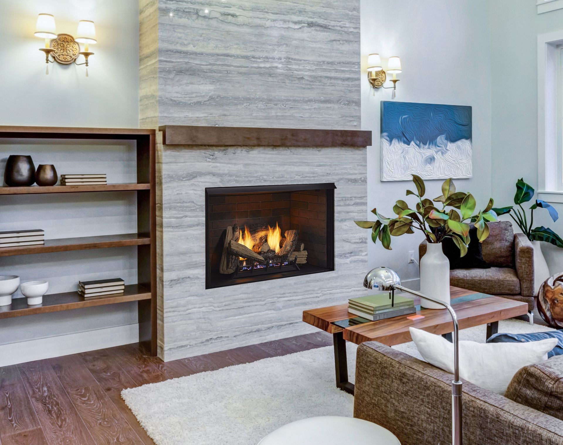 Living room with a fireplace, bookshelf, and modern furnishings. Light blue walls, wood floors, and white rug.