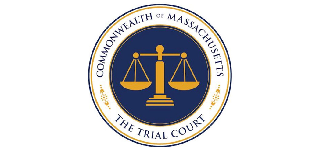Seal of the Commonwealth of Massachusetts Trial Court with gold scales on a navy circle