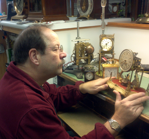 A men repairing a clock