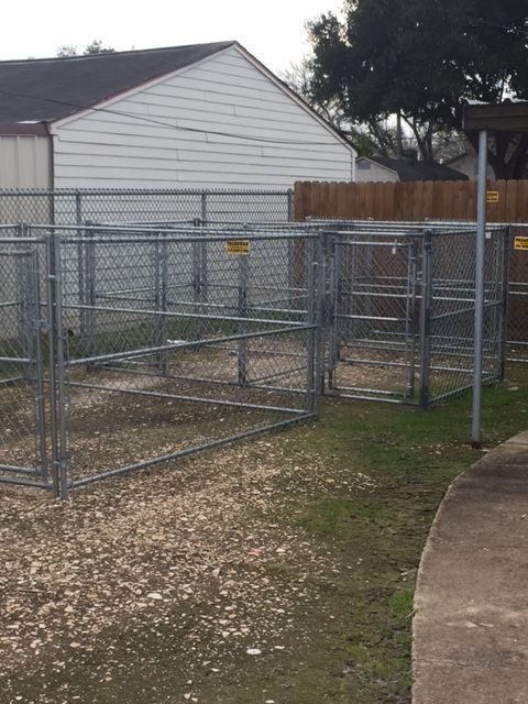 A chain link fence with a yellow sign on it