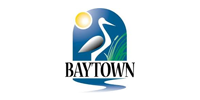 A logo for baytown with a bird , sun and grass.