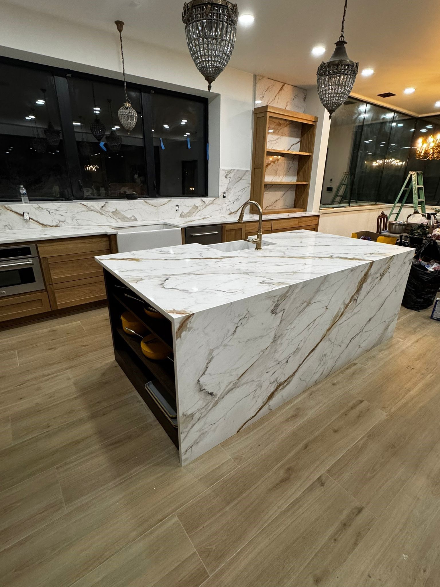 A kitchen with a large island in the middle of it.