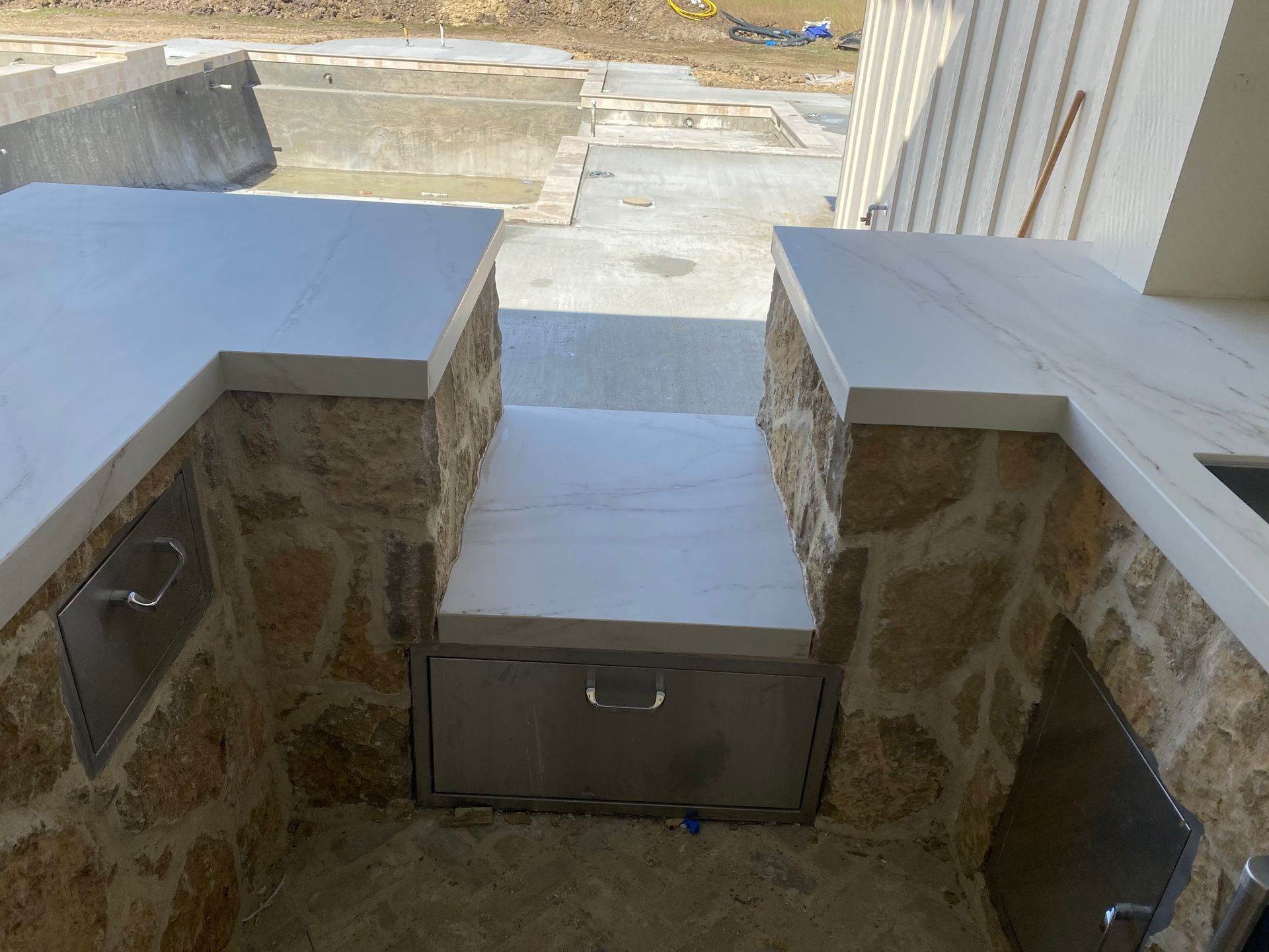 There is a stainless steel drawer in the middle of the room.