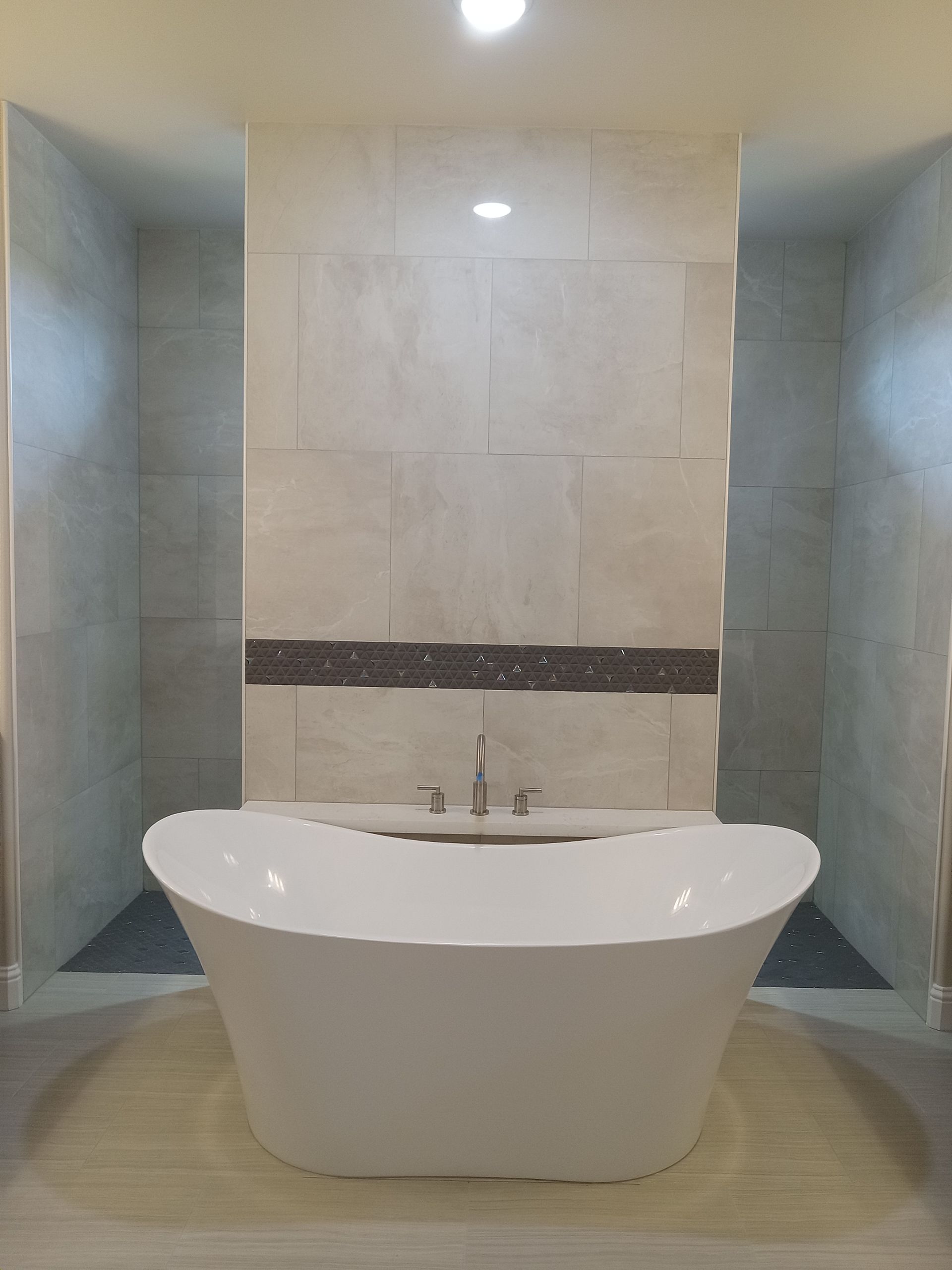 There is a bathtub in the middle of the bathroom.