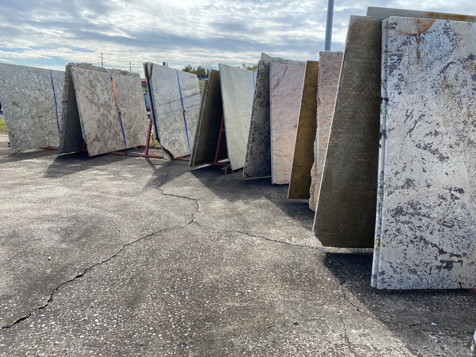 A row of granite slabs sitting on top of a concrete surface.