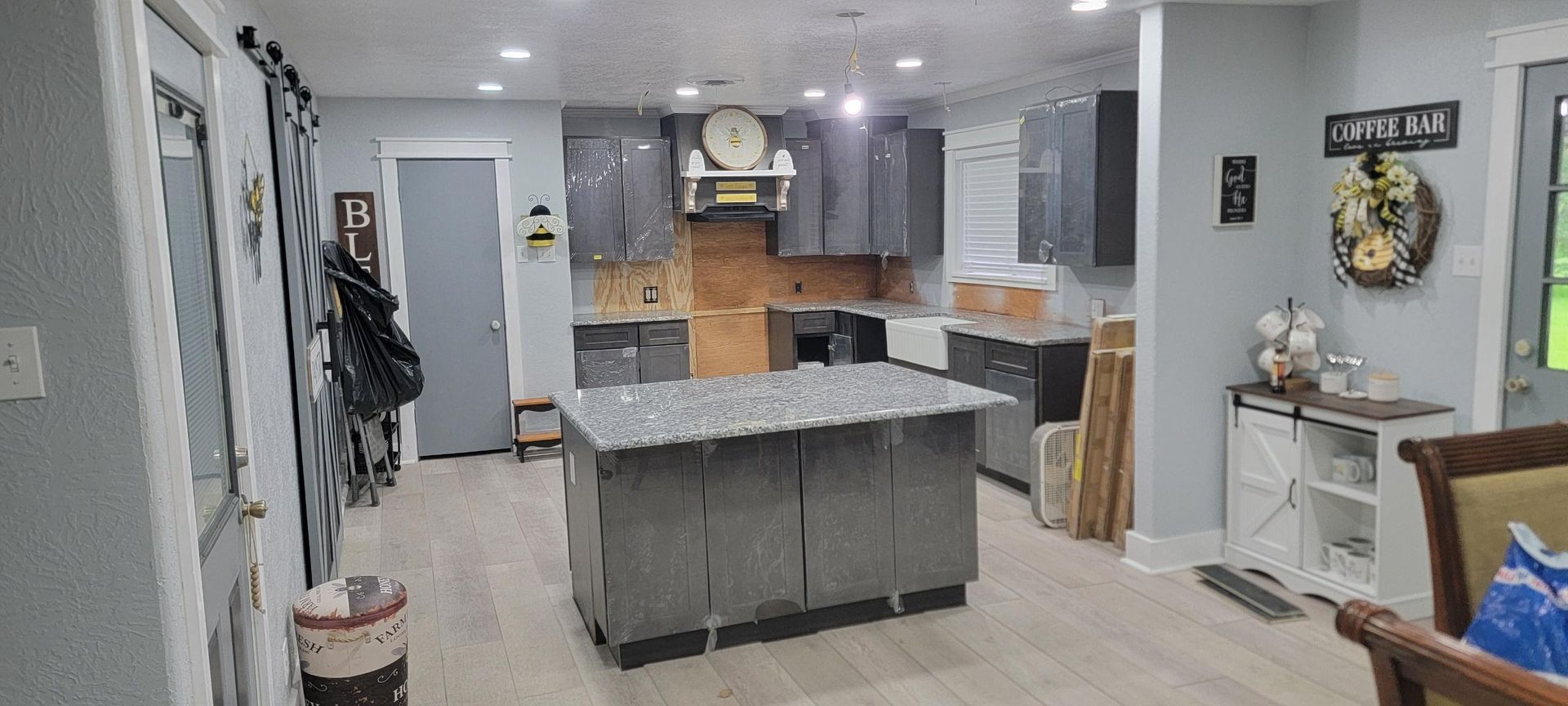 A kitchen with a large island in the middle of the room.