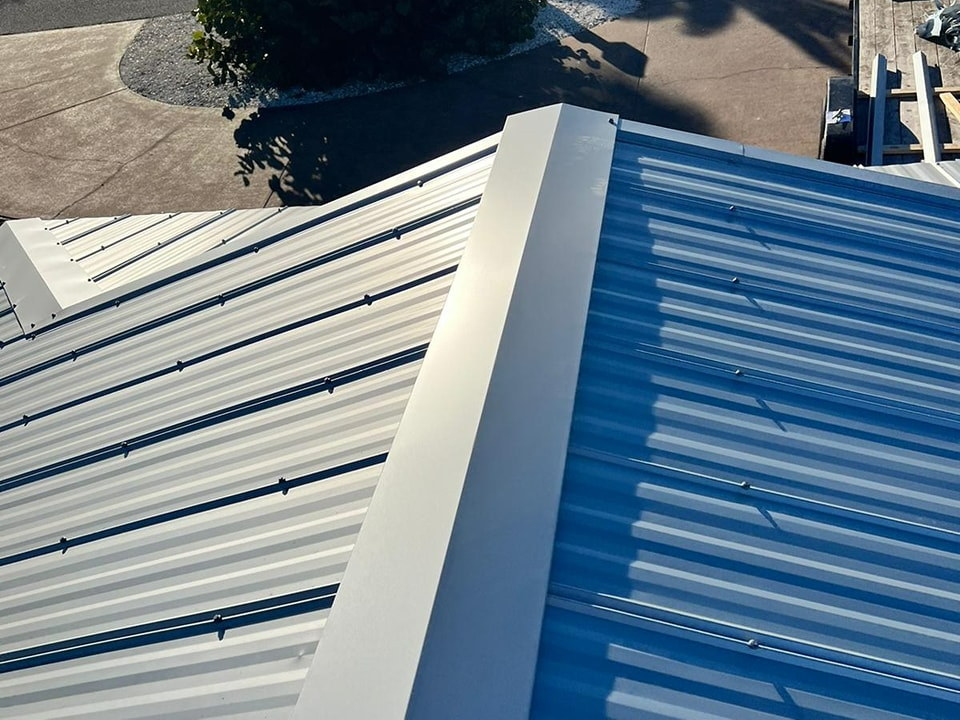 An aerial view of a blue and white roof