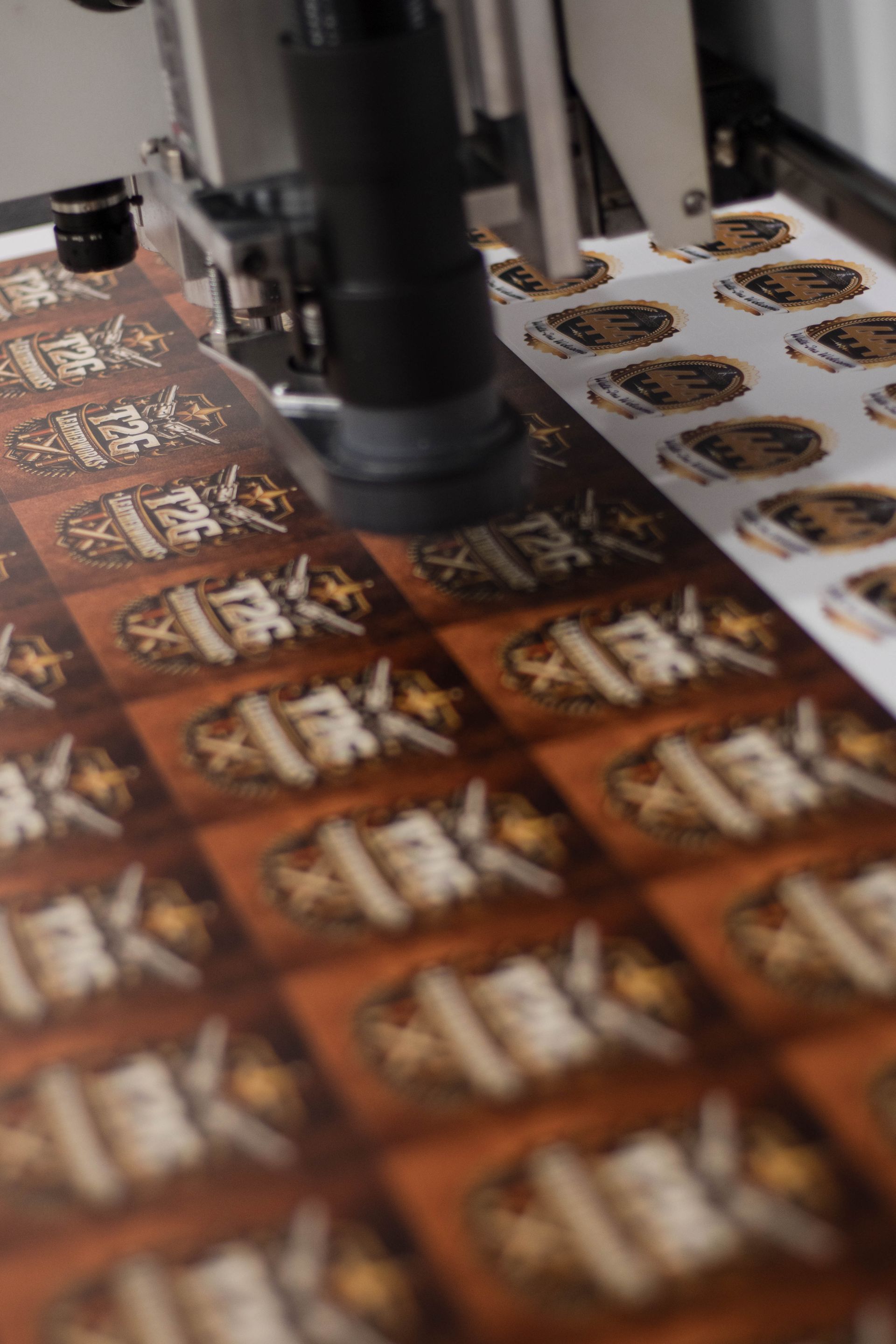Printing machine applying labels to sheets of brown packaged items