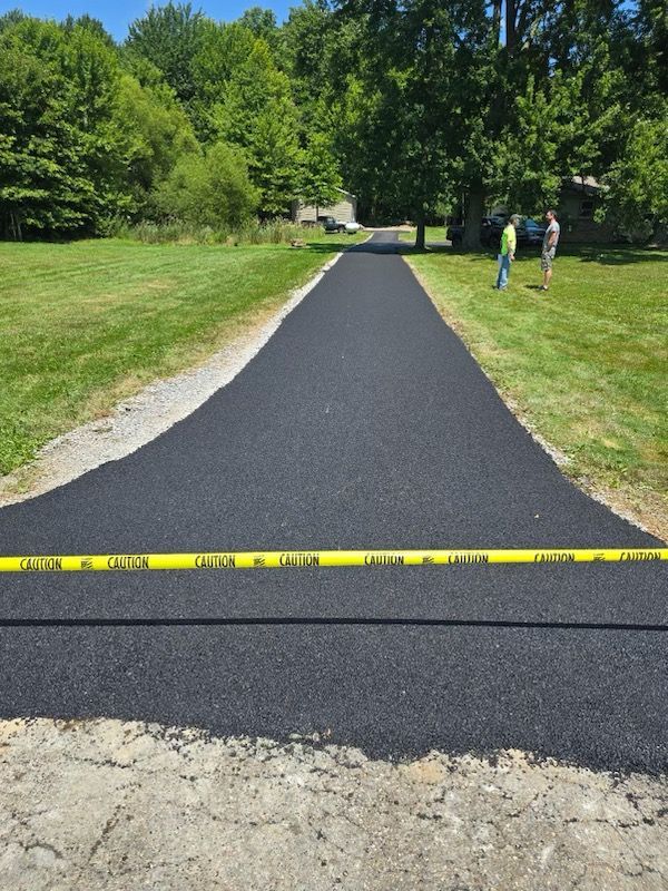 A road with a yellow caution tape on it